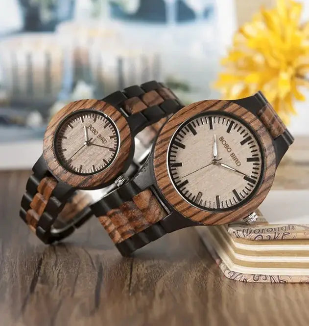Elegant wooden couple watches set with dark and light wood grain design on wooden surface