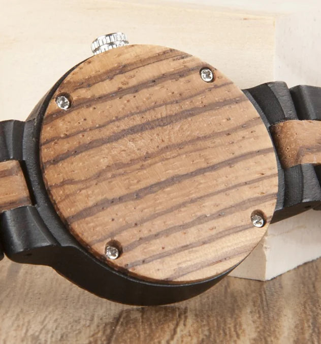 Close-up of wooden couple watches set with natural wood grain and black band details