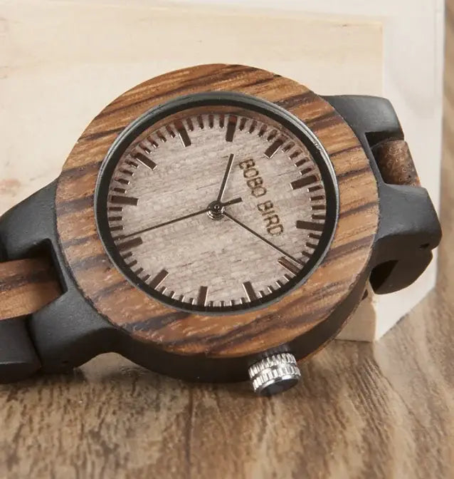 Close-up of wooden couple watches set featuring a round wooden dial and black strap