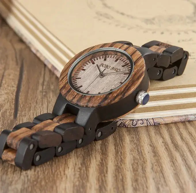 Close-up of wooden couple watches set featuring natural wood grain and minimalist design on a wooden surface