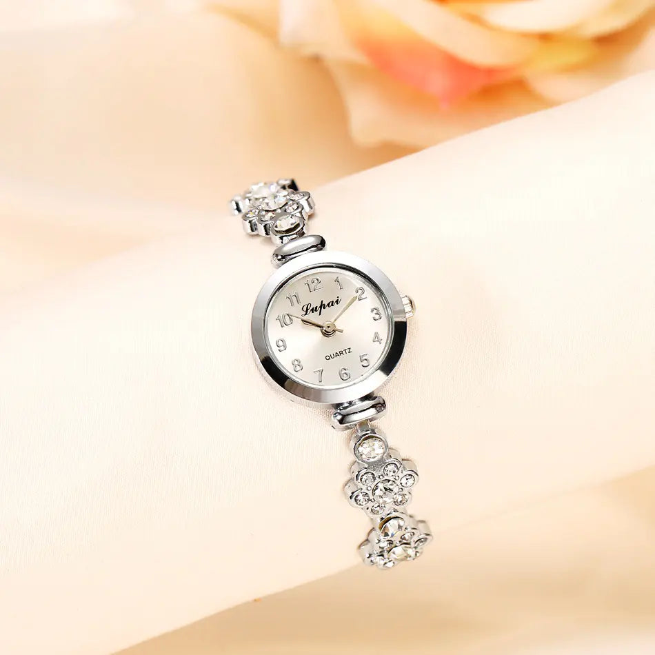 L brand women's fashion pearl watches silver tone floral design close-up